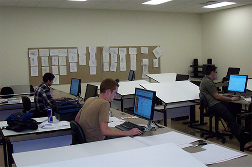 Students doing computer work in a lab.