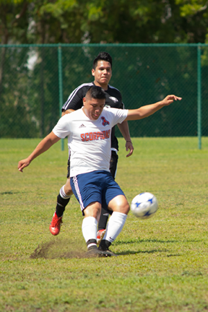 Soccer Player Kicking Ball