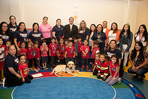 Liberty the Arson Dog visits TSC's early childhood center.