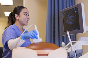 A TSC Diagnostic Medical Sonography (DMS) student practices in the DMS Lab at the ITEC Center.