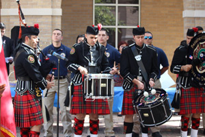Texas Southmost College Police Academy cadets stand at attention as the Brownsville Firefighters Pipes and Drums Honor Guard conclude TSC's Remembrance Day ceremony on Sept. 12, 2016 at North and South Courtyard.