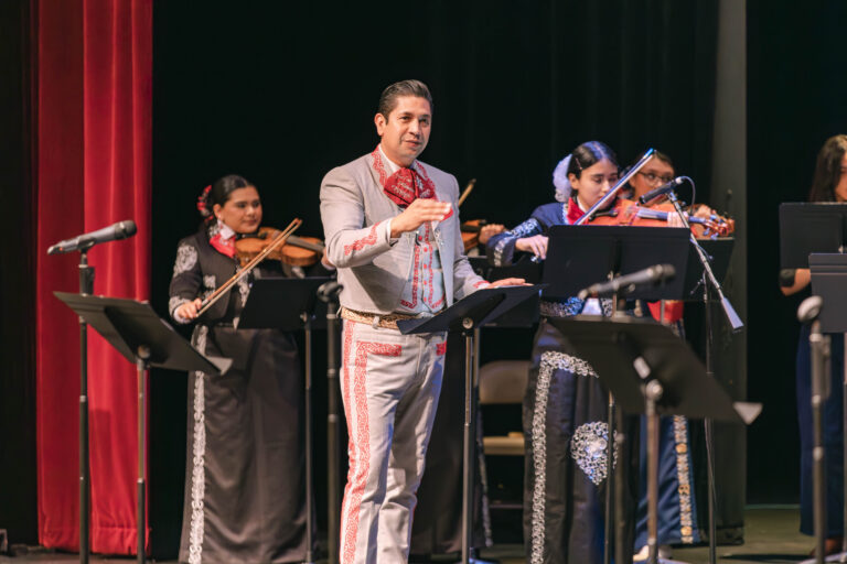 Master Class Conductor Adrian Vaca overseeing the student performance during the grand performance of the Mariachi Summer Camp at the TSC Performing Arts Center on Wednesday, July 3, 2024.