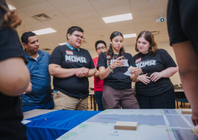 Students discuss strategies for their roles in an interactive board game exercise. The Project Pipeline Architecture Summer Camp featured an array of different activities designed to cultivate the students' interest in the architecture field.