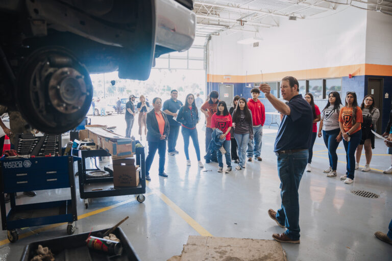 Rolando Euresti, an instructor in the Texas Southmost College Automotive Technology program, shows students how participants in the program are able to get hands-on experience working in the same environment as a typical auto repair shop.