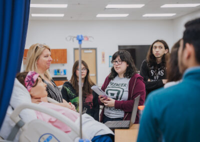 Premiere HS Students were eager to ask questions about the high-tech medical training equipment as Mary Kasprisin, Texas Southmost College Director of Associate Degree Nursing (ADN) program, explained how they assist students in practicing the skills they learn.