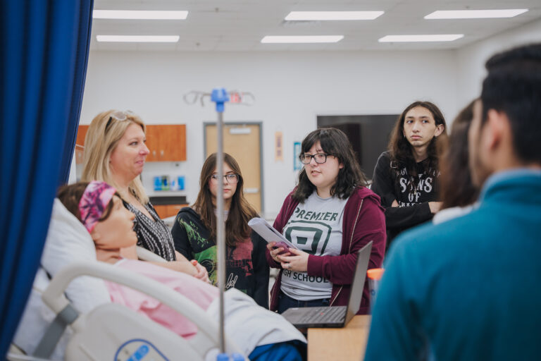 Premiere HS Students were eager to ask questions about the high-tech medical training equipment as Mary Kasprisin, Texas Southmost College Director of Associate Degree Nursing (ADN) program, explained how they assist students in practicing the skills they learn.
