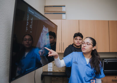 A Texas Southmost College student in the TSC Diagnostic Medical Sonography program explains how they read and interpret the digital imagery as a scan is being conducted.