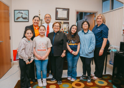 TSC Board of Trustees Vice Chair Delia Saenz stops for a group photo with Breeden Elementary students and faculty. Pictures L to R: Breeden Elementary Librarian Victoria Villanueva, Cameron County District Attorney Luis V. Saenz, TSC Board of Trustees Vice Chair Delia Saenz, Breeden Elementary Principal Petra Torres.