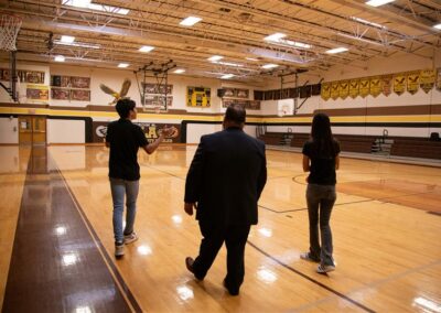 TSC Trustee Edward Camarillo, M.P.P.M., tours the Vela Middle School gymnasium alongside two students as Principal for a Day on Thursday, February 6, 2025.