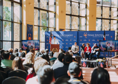 Francisco Quezada addresses the crowd at the podium.