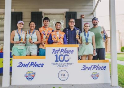 TSC President Dr. Jesus Roberto Rodriguez joined at the podium by the top three teams who ran the TSC Half Marathon. Brian Aranda and Luis Aranda won took first place.