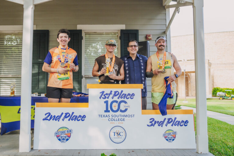 TSC President Dr. Jesus Roberto Rodriguez joins the top three male finishers of the TSC Half Marathon. Ian Andreas (in black shirt) won with a time of 1:30.51.