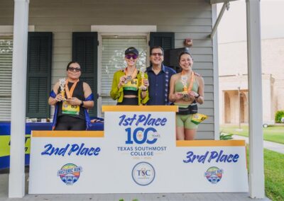 TSC President Dr. Jesus Roberto Rodriguez joins the top three female finishers of the TSC Half Marathon. Denise Nuñez (wearing visor) won with a time of 1:57.28. 2026-03-28 Historic Run DSC_1043 (1).jpg