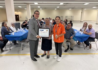 Former TSC Tax Accounting Technology Program Coordinator Maggie Solis is joined by TSC President Dr. Jesus Roberto Rodriguez and Dr. Emma Miller in a photo taken at Solis' retirement party on Friday, May 8, 2026.