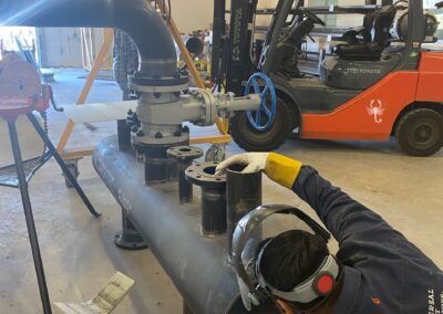 TSC Pipefitting Program instructors and students working in the pipefitting shop.