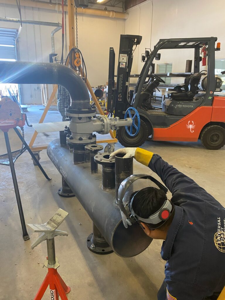 TSC Pipefitting Program instructors and students working in the pipefitting shop.