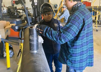 TSC Pipefitting Program instructors and students working in the pipefitting shop.