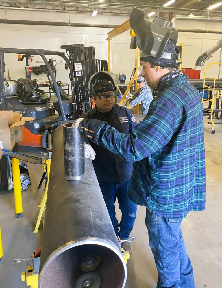 TSC Pipefitting Program instructors and students working in the pipefitting shop.