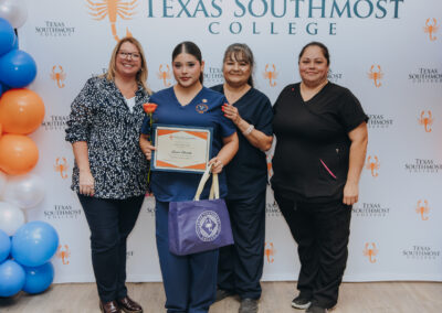 Dual enrollment students from five rural school districts pose for a group photo during their Certified Nursing Assistant pinning ceremony on July 17 at La Villa Early College High School.