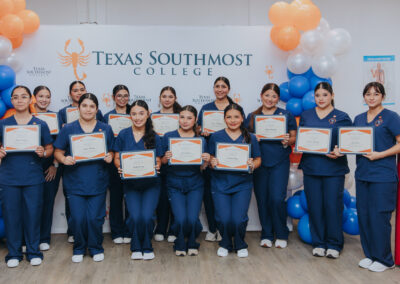 Dual enrollment students from five rural school districts pose for a group photo during their Certified Nursing Assistant pinning ceremony on July 17 at La Villa Early College High School.