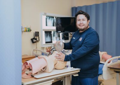 Eleazar Hernandez poses for a photo in a respiratory care lab at Texas Southmost College. In August 2026, Hernandez received the 2026 Neil Allen Memorial Grant, a $3,500 award presented by the Respiratory Care Foundation of Texas. Hernandez was recognized for his academic and research achievements in respiratory care.