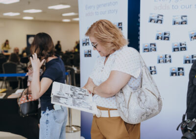 A guest looks through a Texas Southmost College yearbook during Generations Day on Sept. 14, 2026, at the Oliveira Student Services Center.