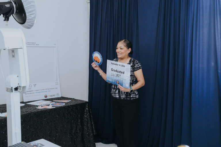 A guest takes a commemorative photo during Texas Southmost College’s Generations Day on Sept. 14, 2026, at the Oliveira Student Services Center.