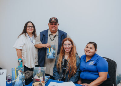 Guests pose with copies of Scorpion’s Quill, Issues 1 and 2, at a showcase for Issue 2 of the student literary and arts journal on April 22, 2026, at the Oliveira Student Services Center.
