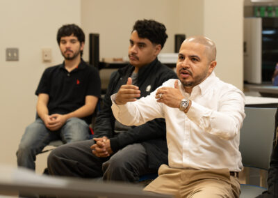 TSC Architecture instructor Martin Jaramillo offers feedback to students during a classroom critique.