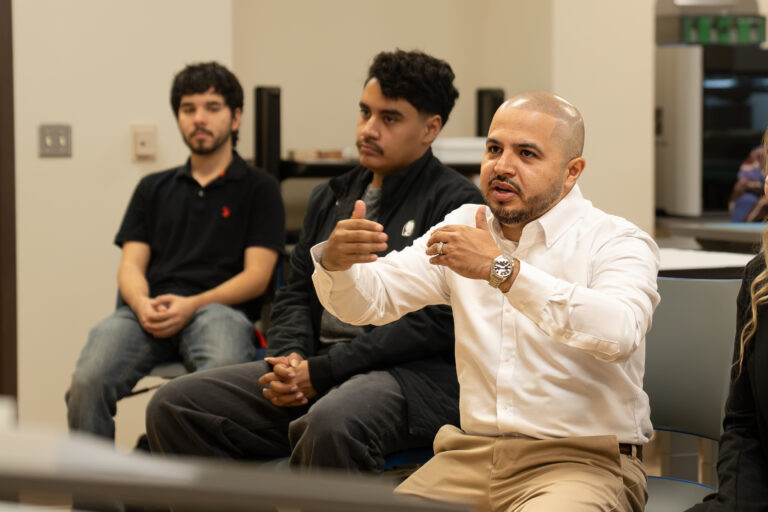 TSC Architecture instructor Martin Jaramillo offers feedback to students during a classroom critique.