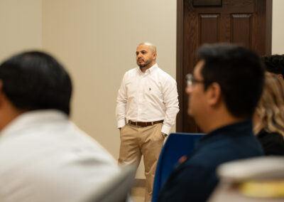 TSC Architecture instructor Martin Jaramillo watches students present their work during a classroom critique.