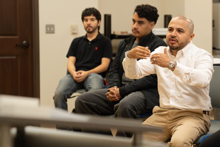TSC Architecture instructor Martin Jaramillo discusses a project with a student presenter during a classroom critique.