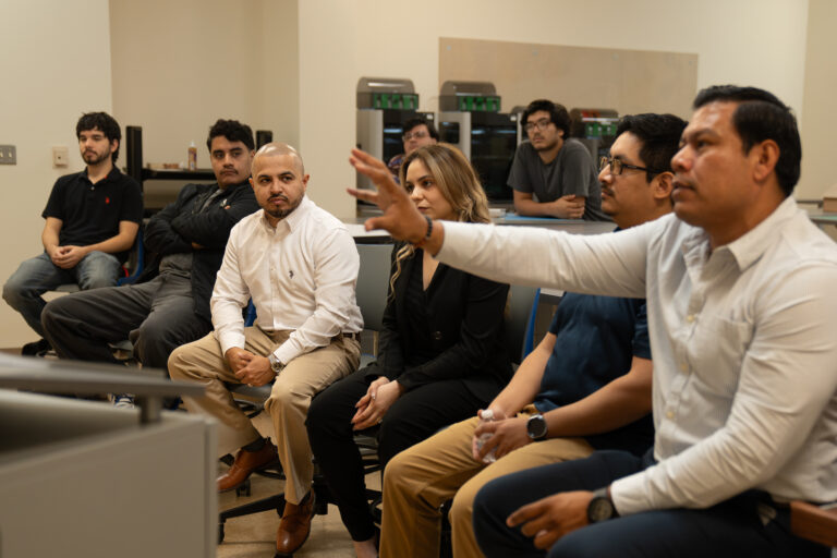 TSC Architecture instructor Martin Jaramillo joins colleagues and students during a classroom critique.