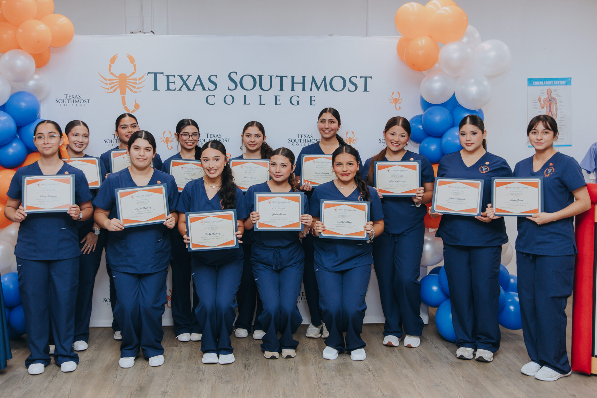 Dual enrollment students from five rural school districts pose for a group photo during their Certified Nursing Assistant pinning ceremony on July 17 at La Villa Early College High School.